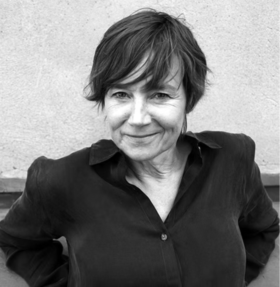 Anke Peterson smiles at the camera. Black and white photo.