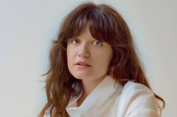 Iryna Tsilyk looking directly at the camera. Black and white portrait.