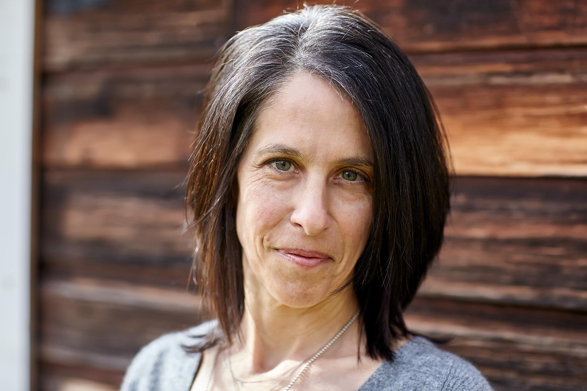 Beth Levison looks at the camera and smiles.