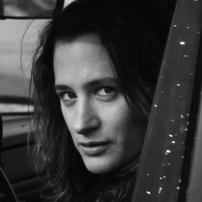 Margaret Brown looks directly at the camera. Headshot in black and white.