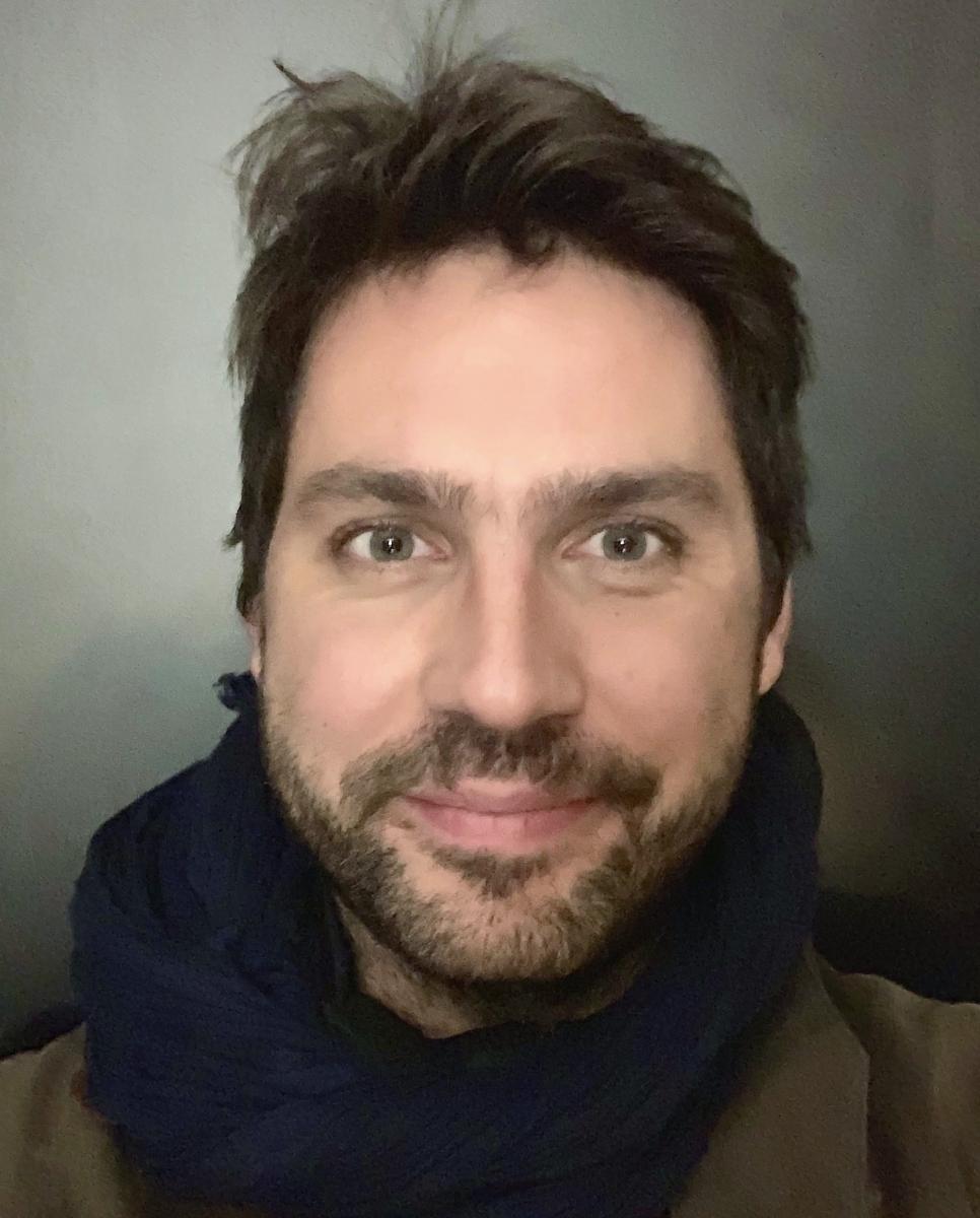 Quentin Laurent looks directly at the camera and smiles.